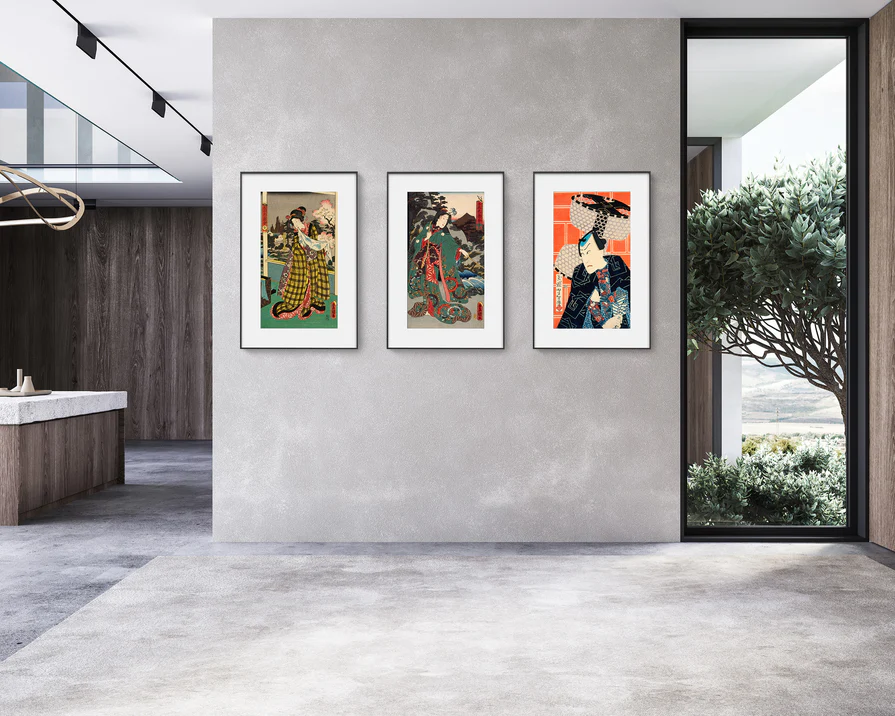 Three color E-Ink art frames arranged on a modern wall